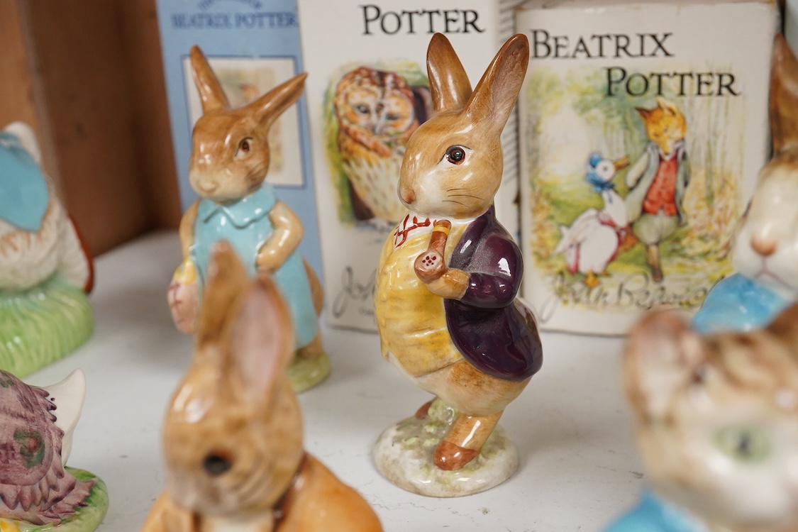 Nine Beswick Beatrix Potter figures, some stamped F. Warne & Co , largest 17cm high